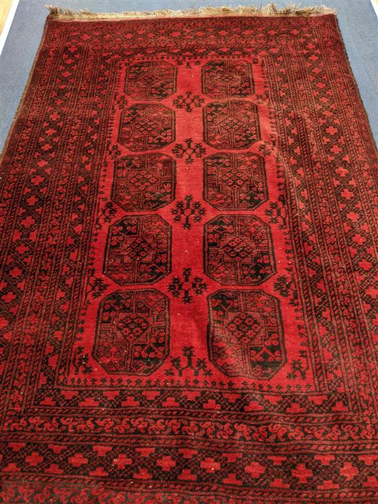 A Belouch red ground carpet 230 x 160cm